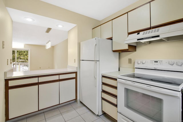 kitchen featuring light tile patterned floors, white cabinets, white appliances, and decorative light fixtures