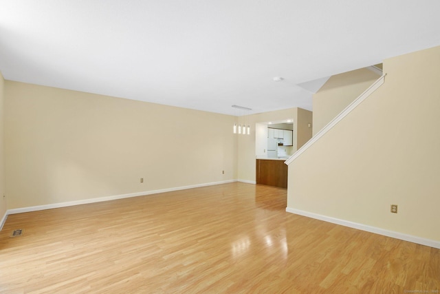 unfurnished living room featuring light hardwood / wood-style flooring