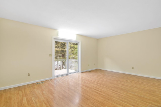 unfurnished room featuring light hardwood / wood-style flooring