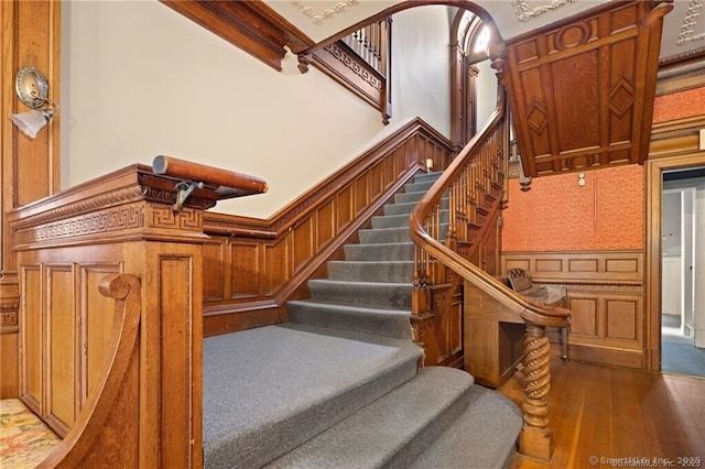 stairs featuring wood-type flooring