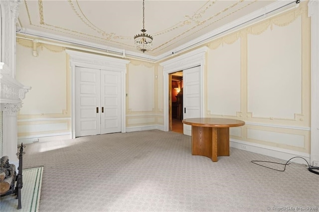 interior space with ornamental molding and carpet floors