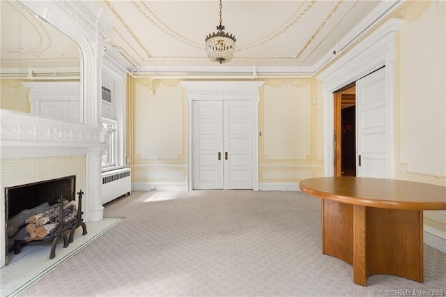 corridor featuring light carpet, radiator, and ornamental molding