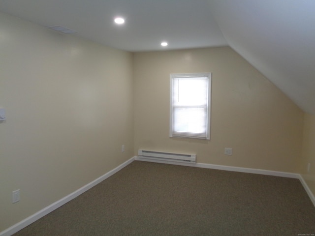 bonus room featuring lofted ceiling, a baseboard heating unit, and carpet