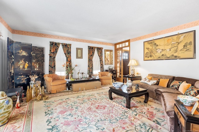 living room with carpet floors and a textured ceiling