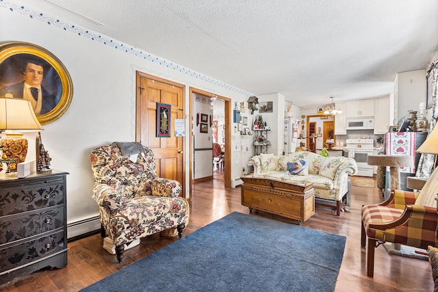 living room with dark wood-type flooring, a notable chandelier, a textured ceiling, and a baseboard heating unit