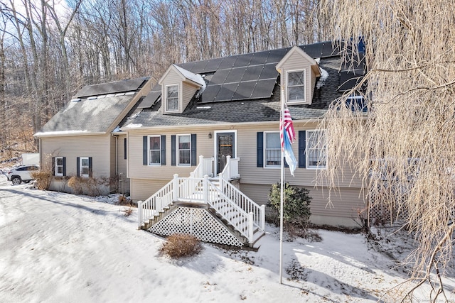 new england style home with solar panels