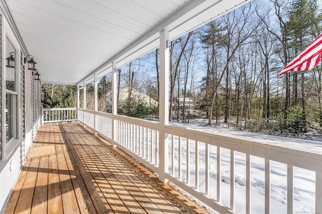 view of snow covered deck