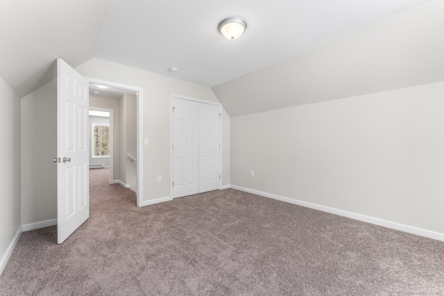 bonus room with vaulted ceiling, carpet floors, and baseboards