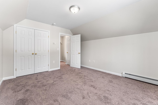 bonus room featuring a baseboard radiator, baseboards, vaulted ceiling, and carpet flooring