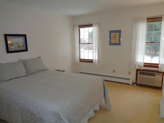 bedroom with carpet floors, a wall mounted AC, and baseboard heating