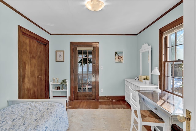 bedroom with crown molding and wood-type flooring