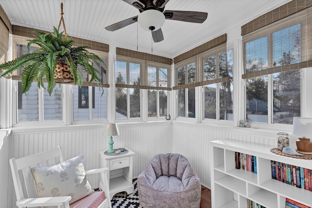 sunroom featuring ceiling fan