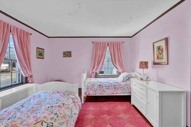 bedroom with multiple windows, radiator, and ornamental molding