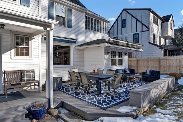 snow covered deck featuring outdoor lounge area