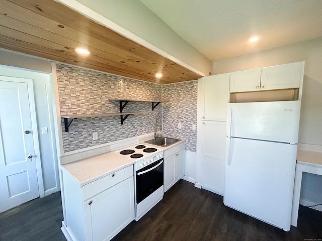 kitchen featuring wall oven, sink, white cabinetry, and white refrigerator