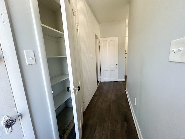 corridor featuring dark hardwood / wood-style floors