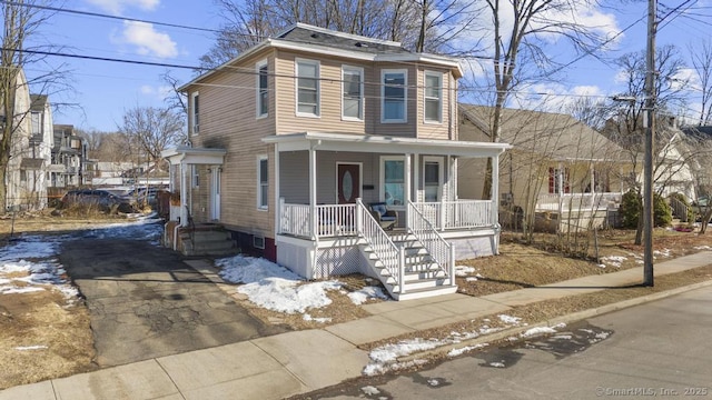 front of property featuring covered porch