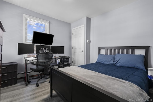 bedroom with light wood-type flooring