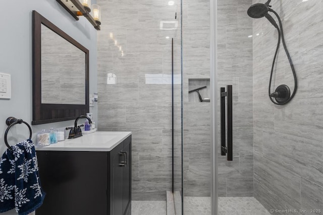 bathroom with vanity and walk in shower