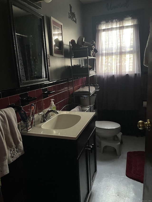 bathroom featuring vanity and toilet