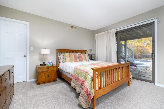 bedroom featuring access to outside and light colored carpet