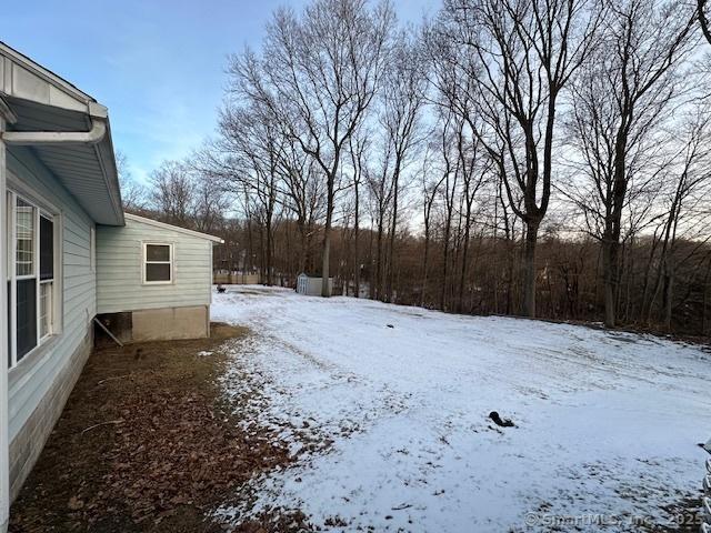 view of yard covered in snow