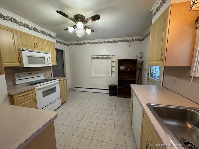 kitchen with sink, white appliances, ceiling fan, a baseboard radiator, and light brown cabinets