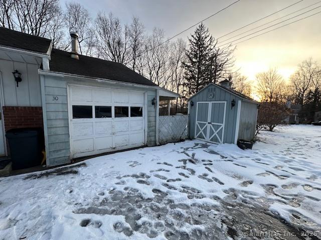 view of snow covered garage