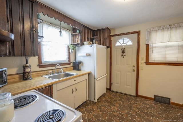 kitchen with white appliances and sink