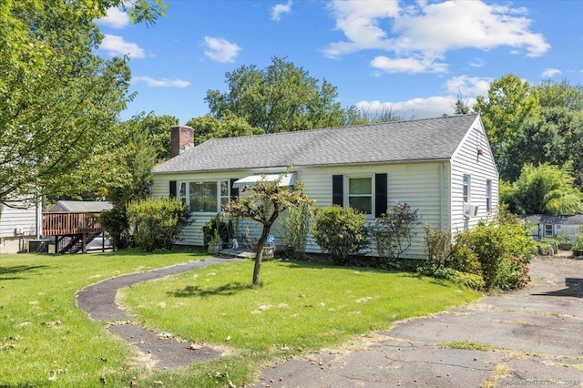 single story home featuring a front yard