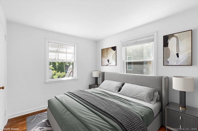 bedroom featuring dark hardwood / wood-style floors