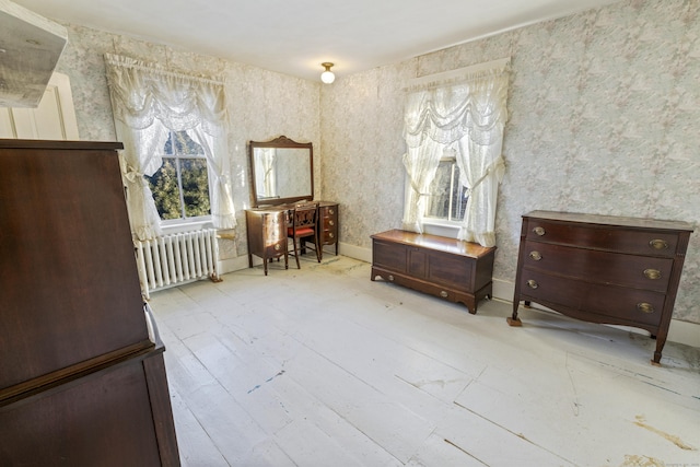 living area with radiator and light wood-type flooring