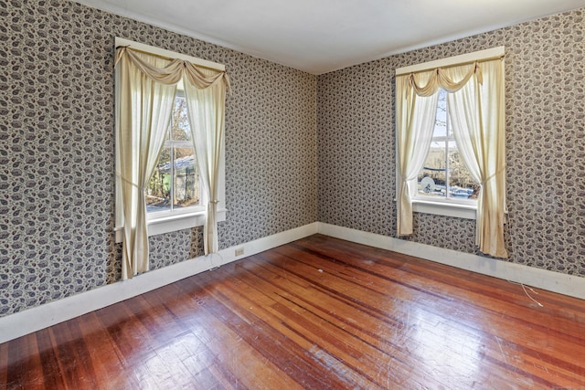 spare room with hardwood / wood-style floors