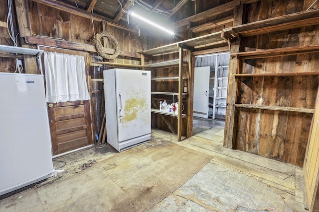 basement featuring fridge