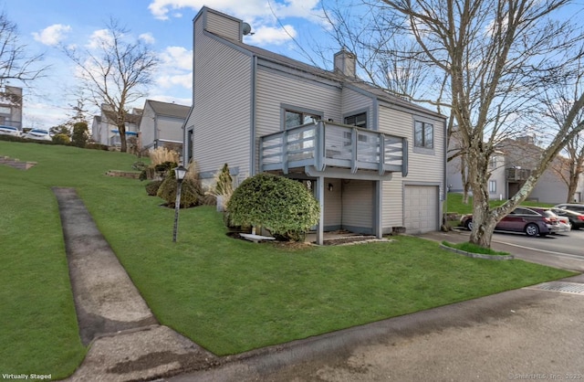 view of property exterior with a garage and a lawn