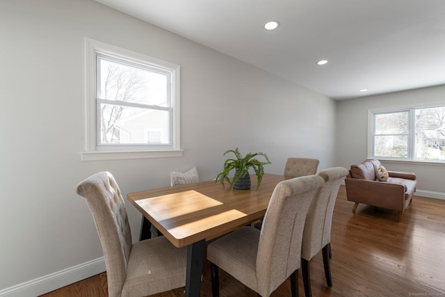 dining room with dark hardwood / wood-style flooring