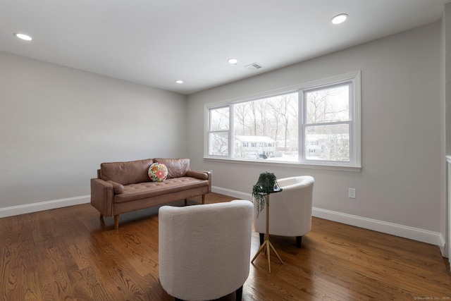 living room featuring dark wood-type flooring