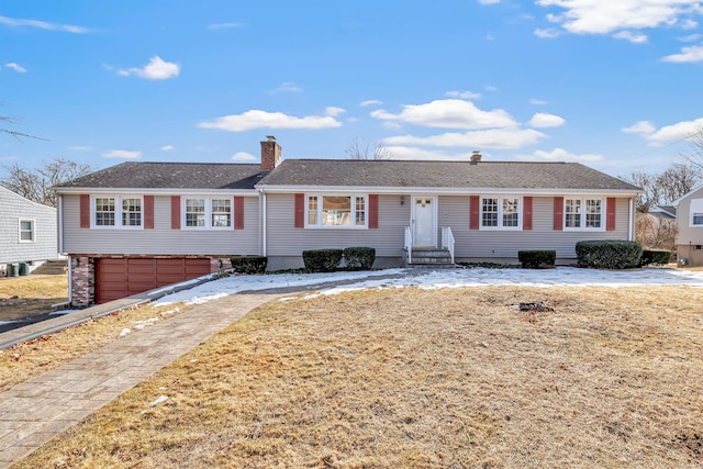 single story home with a garage and a front yard