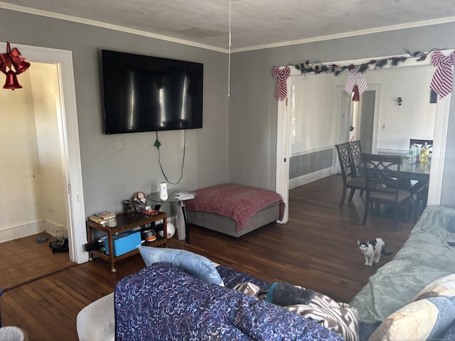 living room with crown molding and dark wood-type flooring