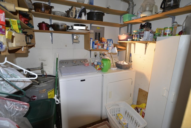 washroom with washing machine and clothes dryer