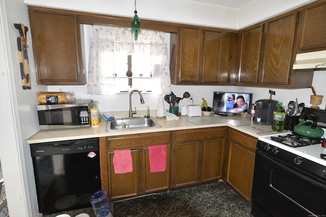 kitchen with black dishwasher, sink, and gas range oven