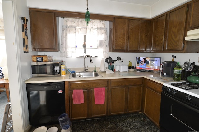 kitchen with gas range oven, black dishwasher, sink, and hanging light fixtures