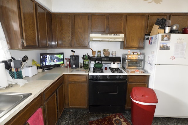 kitchen with white fridge, sink, and range with gas stovetop