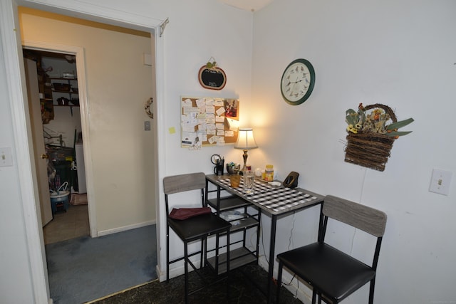 dining room with dark carpet