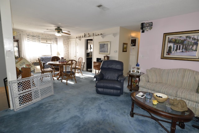 living room with carpet floors and ceiling fan