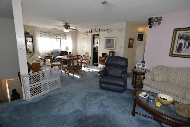 carpeted living room with ceiling fan