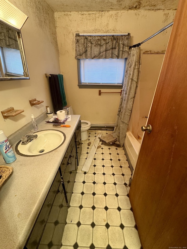 full bathroom with vanity, a baseboard heating unit, toilet, and shower / tub combo with curtain