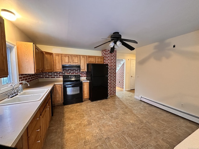 kitchen featuring extractor fan, sink, tasteful backsplash, baseboard heating, and black appliances