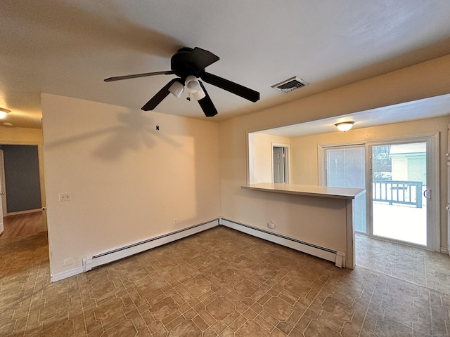 empty room with a baseboard radiator and ceiling fan