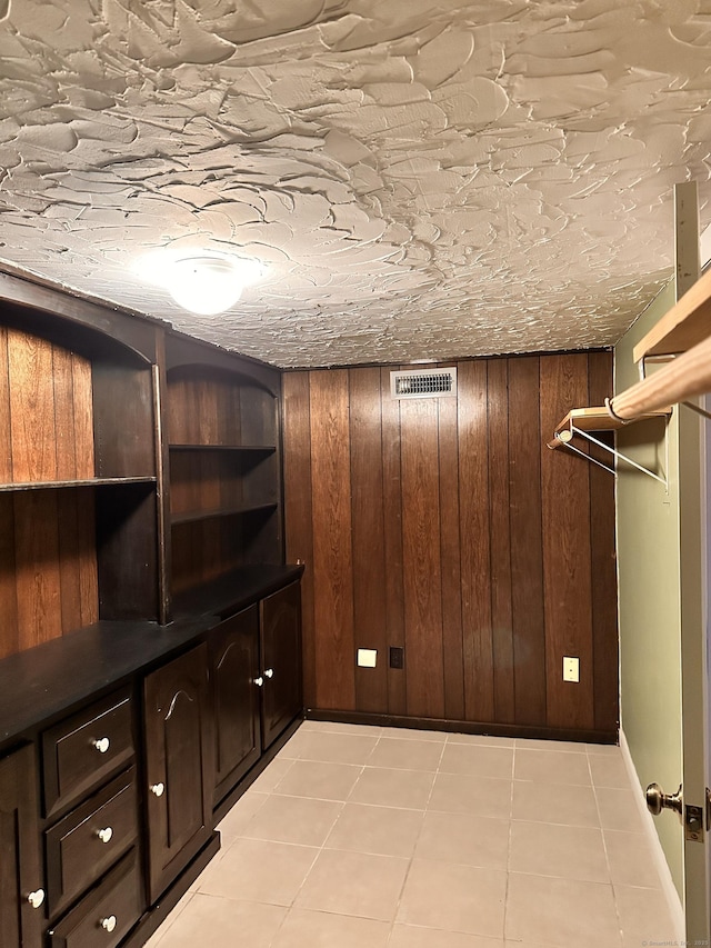 spacious closet featuring light tile patterned floors